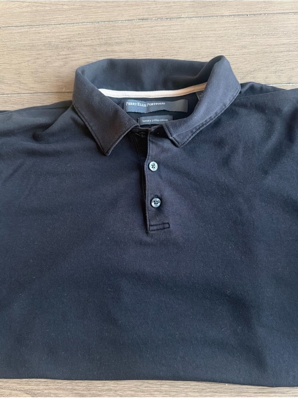 Men’s Perry Ellis Black Polo Shirt
Used
Size XL
